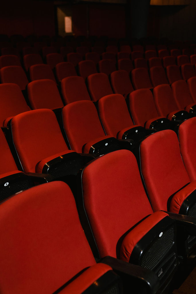 Rows of empty red seats in a cinema